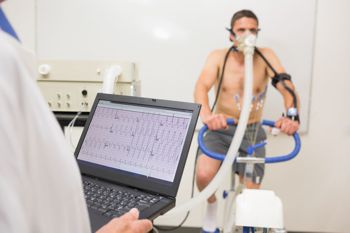 man on an exercise bike being tested for fitness level